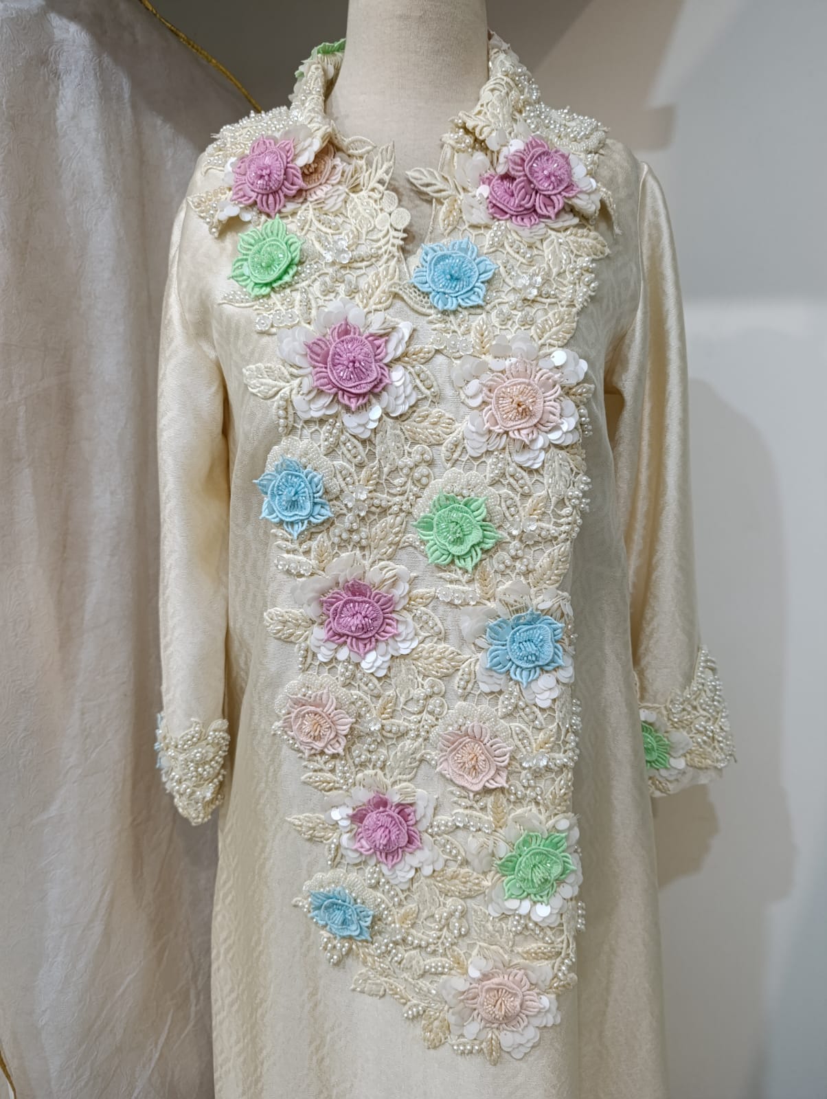 Cream piece with intricate pastel 3D floral embroidery and pearl detailing