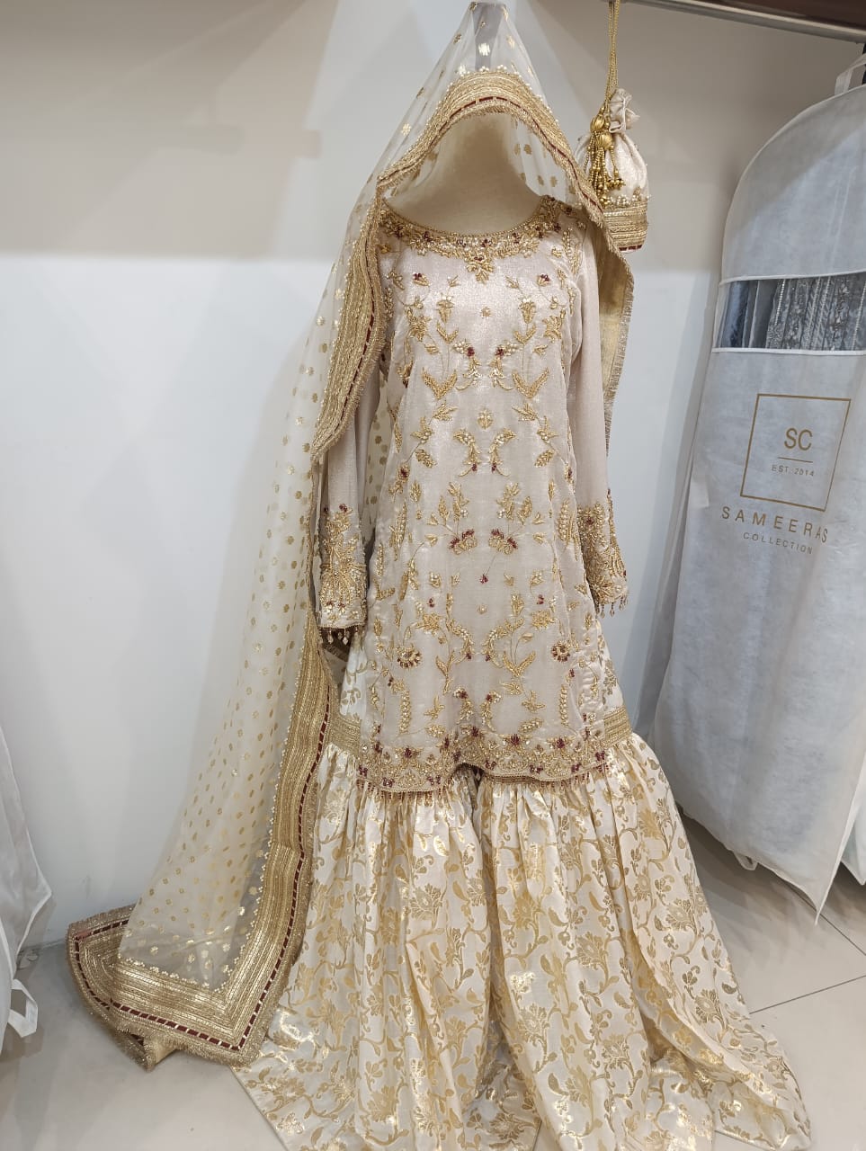 Champagne ivory three-piece formal suit with gold zardozi